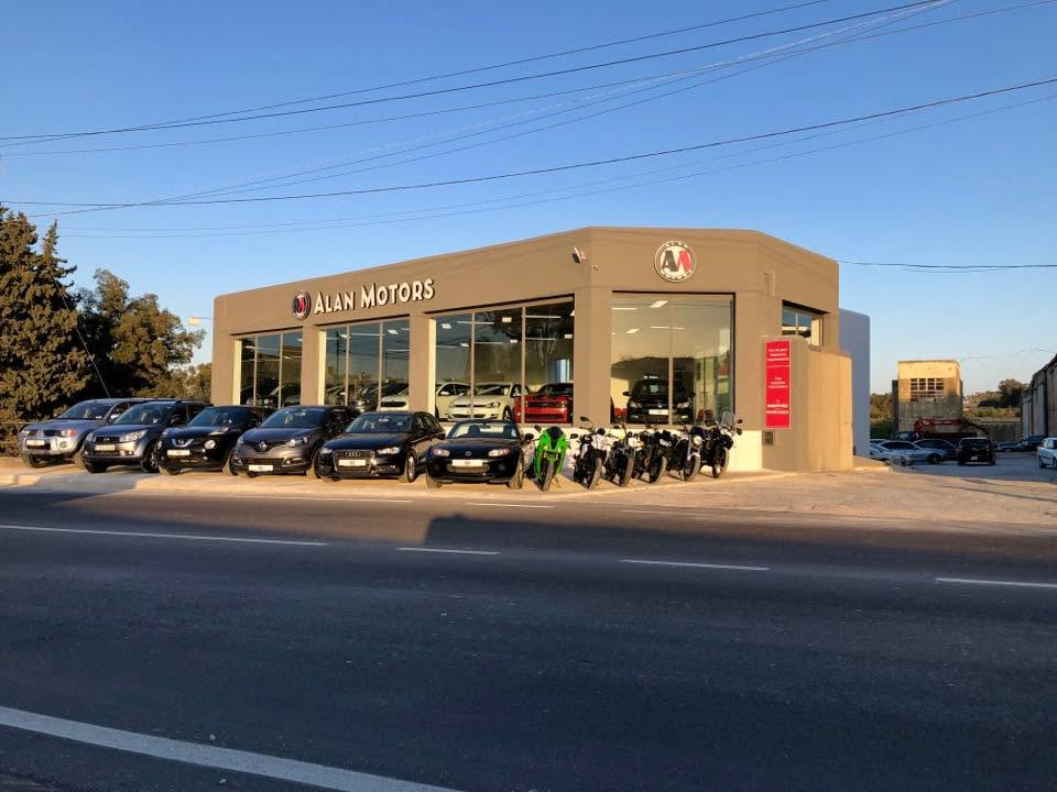Alan Motors showroom in Attard with cars and motorcycles on display